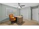 Light-filled bedroom with built-in desk and seating at 12717 Carte Dr, Tampa, FL 33618