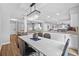 Open concept dining room with modern chandelier and kitchen access at 12717 Carte Dr, Tampa, FL 33618