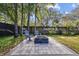 Relaxing fire pit patio with chairs and landscaping at 12717 Carte Dr, Tampa, FL 33618