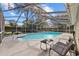 Inviting screened pool area with lounge chairs at 12717 Carte Dr, Tampa, FL 33618