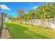 Landscaped backyard with a privacy fence at 14042 Starboard Dr, Seminole, FL 33776