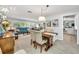 Dining area with wooden table and view into living room at 14042 Starboard Dr, Seminole, FL 33776