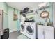 Laundry room with washer, dryer, and extra storage at 14042 Starboard Dr, Seminole, FL 33776