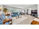 Light-filled living room featuring comfy sofas and flooring at 14042 Starboard Dr, Seminole, FL 33776