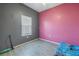 Cozy bedroom with grey and pink walls and wood-look floors at 1410 Prescott S St, St Petersburg, FL 33712