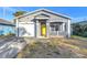 Newly built home with gray exterior and attached garage at 1410 Prescott S St, St Petersburg, FL 33712