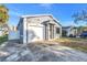 Newly built home with gray exterior and attached garage at 1410 Prescott S St, St Petersburg, FL 33712