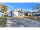 Newly built home with gray exterior and attached garage at 1410 Prescott S St, St Petersburg, FL 33712