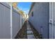 Side yard with stone path, fence, and exterior door at 1410 Prescott S St, St Petersburg, FL 33712