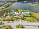 Community pool and recreation area with lake views at 14341 Editors Note St, Ruskin, FL 33573