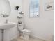 Clean bathroom with pedestal sink and updated fixtures at 14341 Editors Note St, Ruskin, FL 33573