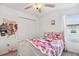 Bedroom with Hello Kitty decor and white bed frame at 14341 Editors Note St, Ruskin, FL 33573