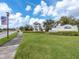 Welcoming community entrance with lush landscaping at 14341 Editors Note St, Ruskin, FL 33573