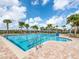 Inviting lap pool with plenty of lounge chairs at 14341 Editors Note St, Ruskin, FL 33573