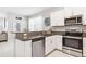 Modern kitchen with stainless steel appliances and granite countertops at 14341 Editors Note St, Ruskin, FL 33573