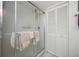 Clean bathroom with shower stall and linen closet at 14525 Catalina Cir, Seminole, FL 33776