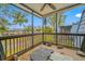 Cozy screened porch overlooking the backyard and neighboring houses at 14525 Catalina Cir, Seminole, FL 33776