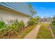 Landscaped walkway leading to the back of the property at 14525 Catalina Cir, Seminole, FL 33776