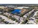 Aerial view of townhouses and a pond at 14935 Skip Jack Loop # 106, Lakewood Ranch, FL 34202