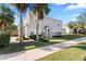 Two-story house with white shutters and a landscaped lawn at 14935 Skip Jack Loop # 106, Lakewood Ranch, FL 34202