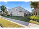 Two-story house with white shutters and a side yard at 14935 Skip Jack Loop # 106, Lakewood Ranch, FL 34202