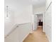 Upstairs hallway with carpet and doors to bedrooms and bathroom at 14935 Skip Jack Loop # 106, Lakewood Ranch, FL 34202