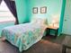 Cozy bedroom with a full-size bed and beachy decor at 16330 Gulf Blvd # 306, Redington Beach, FL 33708