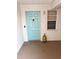 Light teal front door to condo unit #306 at 16330 Gulf Blvd # 306, Redington Beach, FL 33708