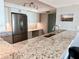 Granite countertop kitchen with breakfast bar at 16330 Gulf Blvd # 306, Redington Beach, FL 33708