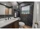 Modern bathroom with dark geometric wallpaper and a stylish vanity at 1690 74Th N Ave, St Petersburg, FL 33702