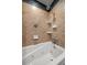 Updated bathroom with a jetted tub and neutral tile at 1690 74Th N Ave, St Petersburg, FL 33702