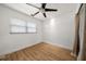 Simple bedroom with hardwood floors and a window with blinds at 1690 74Th N Ave, St Petersburg, FL 33702