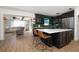 Modern kitchen features dark cabinetry, white countertops, and a kitchen island at 1690 74Th N Ave, St Petersburg, FL 33702