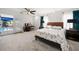 Main bedroom with pool view, a large bed, and plenty of natural light at 1690 74Th N Ave, St Petersburg, FL 33702