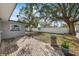 Brick paved backyard patio area with fire pit at 1720 Hampton Ln, Clearwater, FL 33756