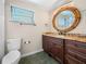 Elegant bathroom with granite countertop and large vanity at 1720 Hampton Ln, Clearwater, FL 33756