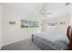 Comfortable bedroom with a queen-size bed and carpet flooring at 1720 Hampton Ln, Clearwater, FL 33756