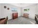 Bright bedroom with wood furniture and carpet flooring at 1720 Hampton Ln, Clearwater, FL 33756