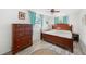 Bedroom with wooden furniture, light walls, and a ceiling fan at 1720 Hampton Ln, Clearwater, FL 33756