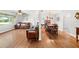 Open concept dining area with a wooden table and chairs, adjacent to the living room at 1720 Hampton Ln, Clearwater, FL 33756