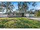 Ranch style home with a large front yard at 1720 Hampton Ln, Clearwater, FL 33756