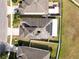 Aerial view of house featuring solar panels at 18398 Aylesbury Ln, Land O Lakes, FL 34638