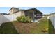 Small backyard with fenced enclosure and covered patio at 18398 Aylesbury Ln, Land O Lakes, FL 34638