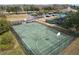 Green basketball court with fencing, aerial view at 18398 Aylesbury Ln, Land O Lakes, FL 34638