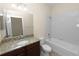 Bathroom with granite countertop vanity and bathtub at 18398 Aylesbury Ln, Land O Lakes, FL 34638