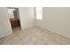 Bedroom with tile flooring and ensuite bathroom at 18398 Aylesbury Ln, Land O Lakes, FL 34638