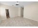 Spacious bedroom with tile floors and neutral color walls at 18398 Aylesbury Ln, Land O Lakes, FL 34638