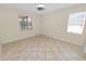 Spacious bedroom with tile flooring and large window at 18398 Aylesbury Ln, Land O Lakes, FL 34638