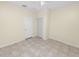 Bright bedroom with tile flooring, a closet, and neutral walls at 18398 Aylesbury Ln, Land O Lakes, FL 34638