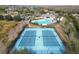 Community tennis courts near pool and clubhouse at 18398 Aylesbury Ln, Land O Lakes, FL 34638